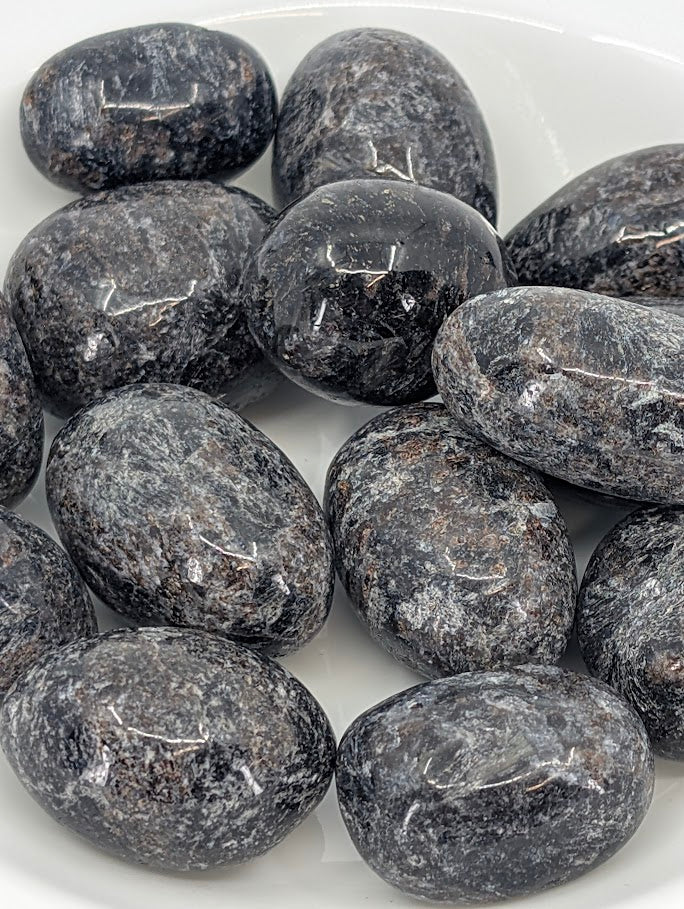 Close-up of Astrophyllite with Mixed Garnet showing metallic and red tones