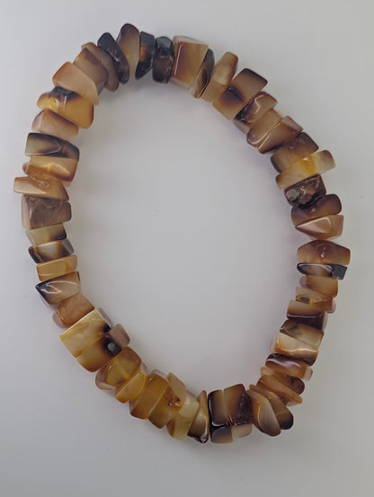 Baltic amber chip bracelet photographed on white background