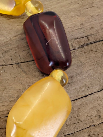 Macro view of a cognac Baltic Amber bead showing natural internal textures and high-gloss fossilized resin luster