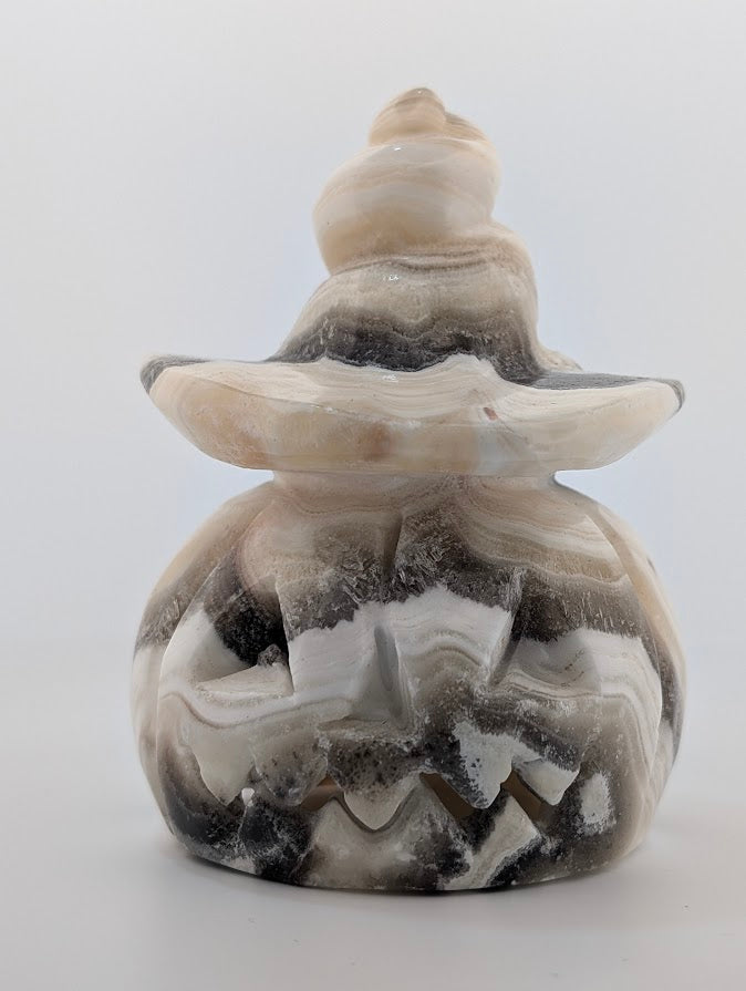 Banded calcite pumpkin witch hat carving – front view