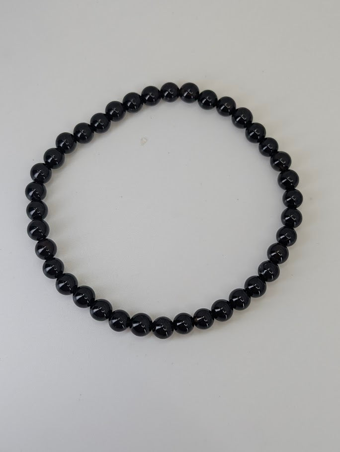 Natural Brazilian Black Agate bracelet showing smooth round polish