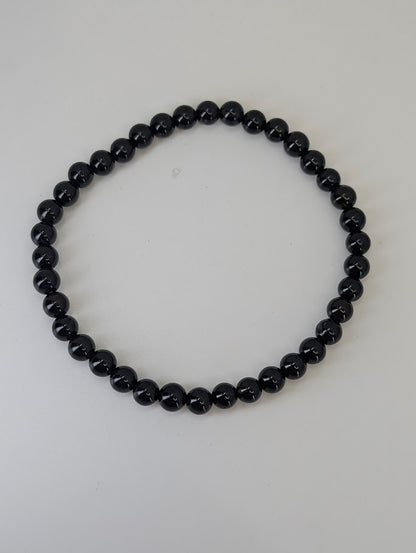 Natural Brazilian Black Agate bracelet showing smooth round polish