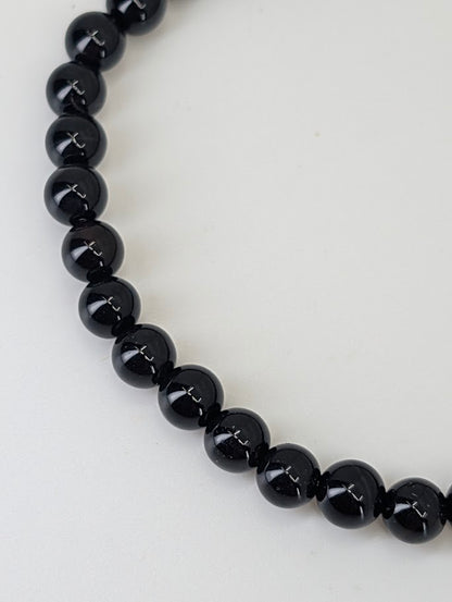 4mm Black Agate bracelets stacked together showing minimalist style