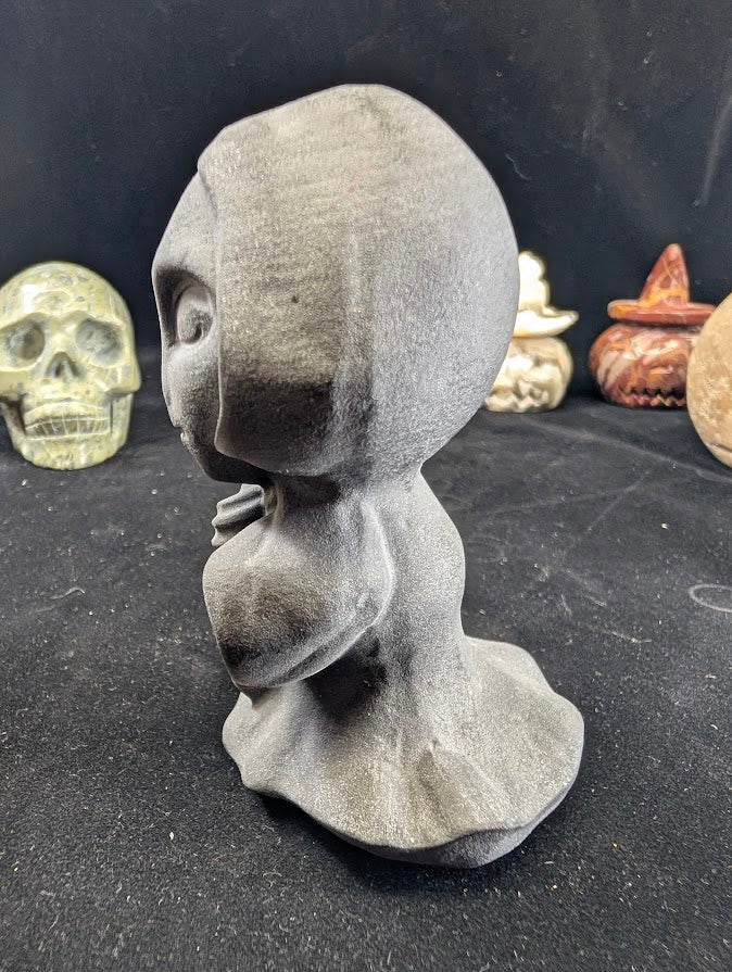 Black Obsidian Death carving with face variant - angled view
