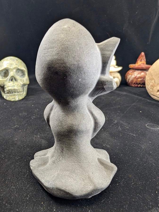 Black Obsidian Death carving with face variant - angled view