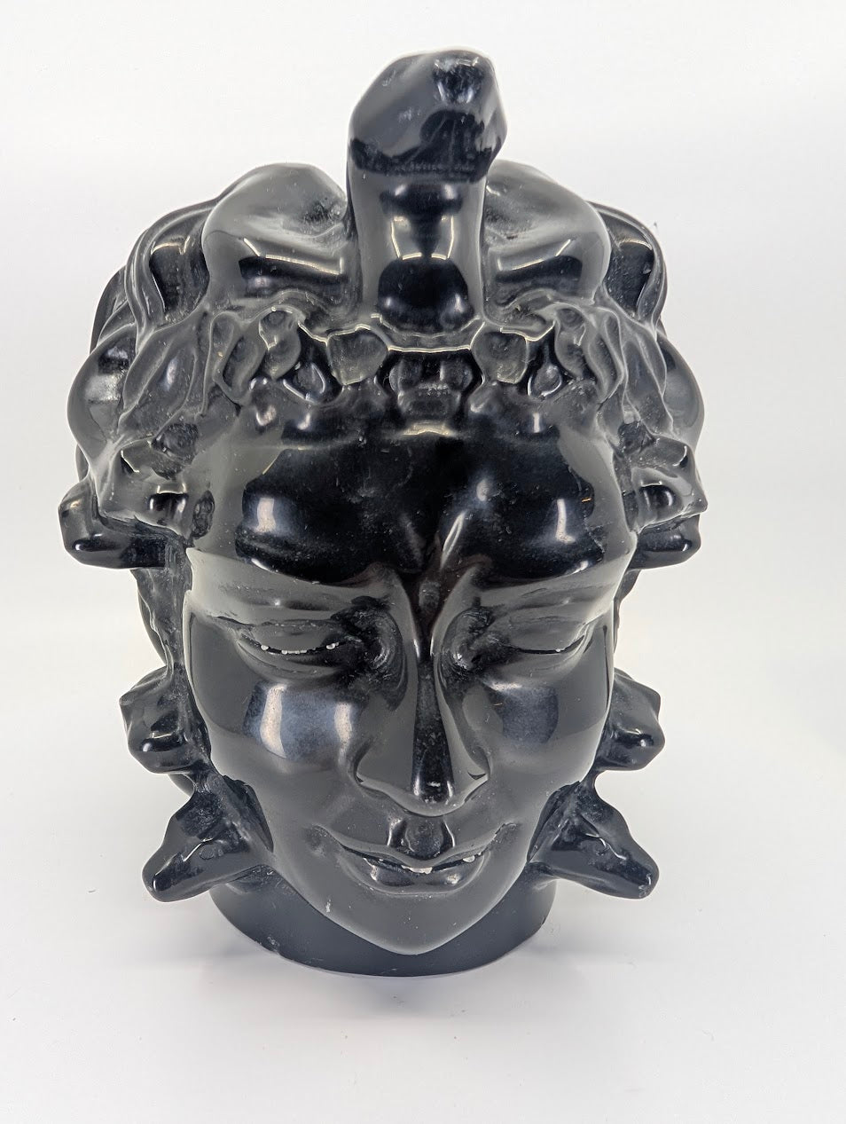 Front view of 2.08 kg black obsidian Medusa carving