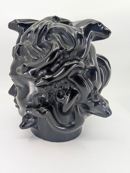 Rear-angle shot showing snake forms and polish