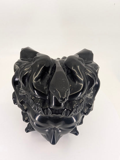 Top-down view of Medusa carving with serpents