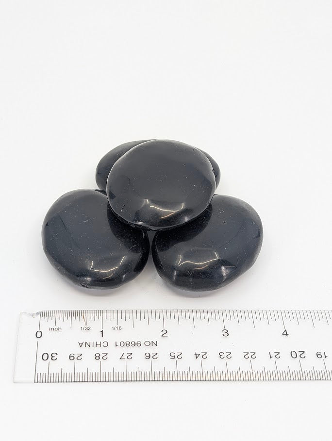 Group of Black Obsidian Palm Stones with ruler scale