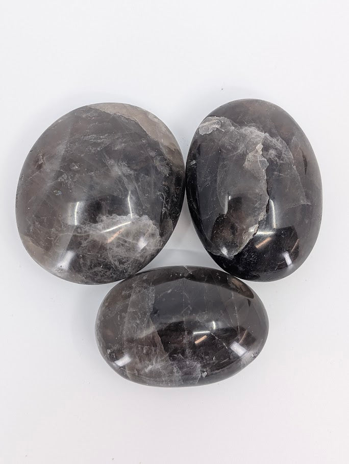 Top view of three palms with pattern variation