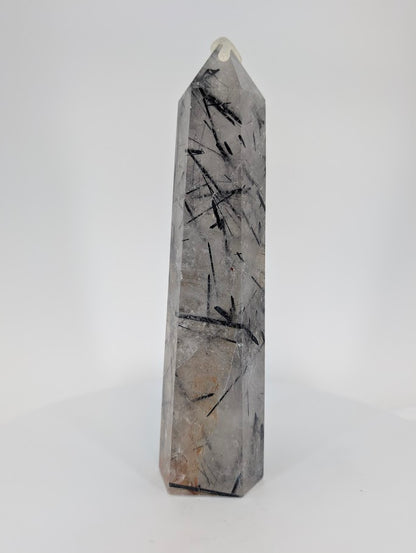 Tourmalinated Quartz tower showing dense inclusions