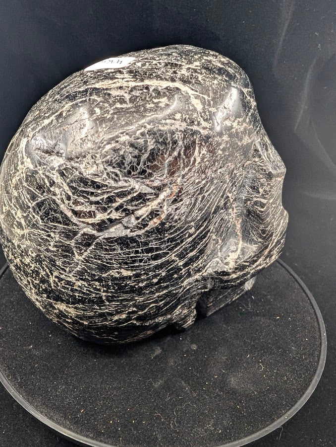 Left side profile with dense striations and polished planes