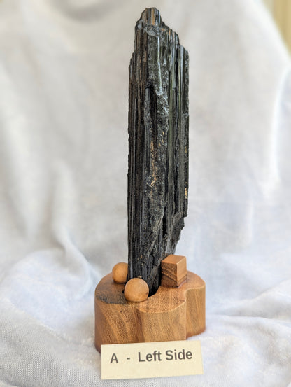 Side profile of 390g raw Black Tourmaline tower showcasing natural crystal growth.