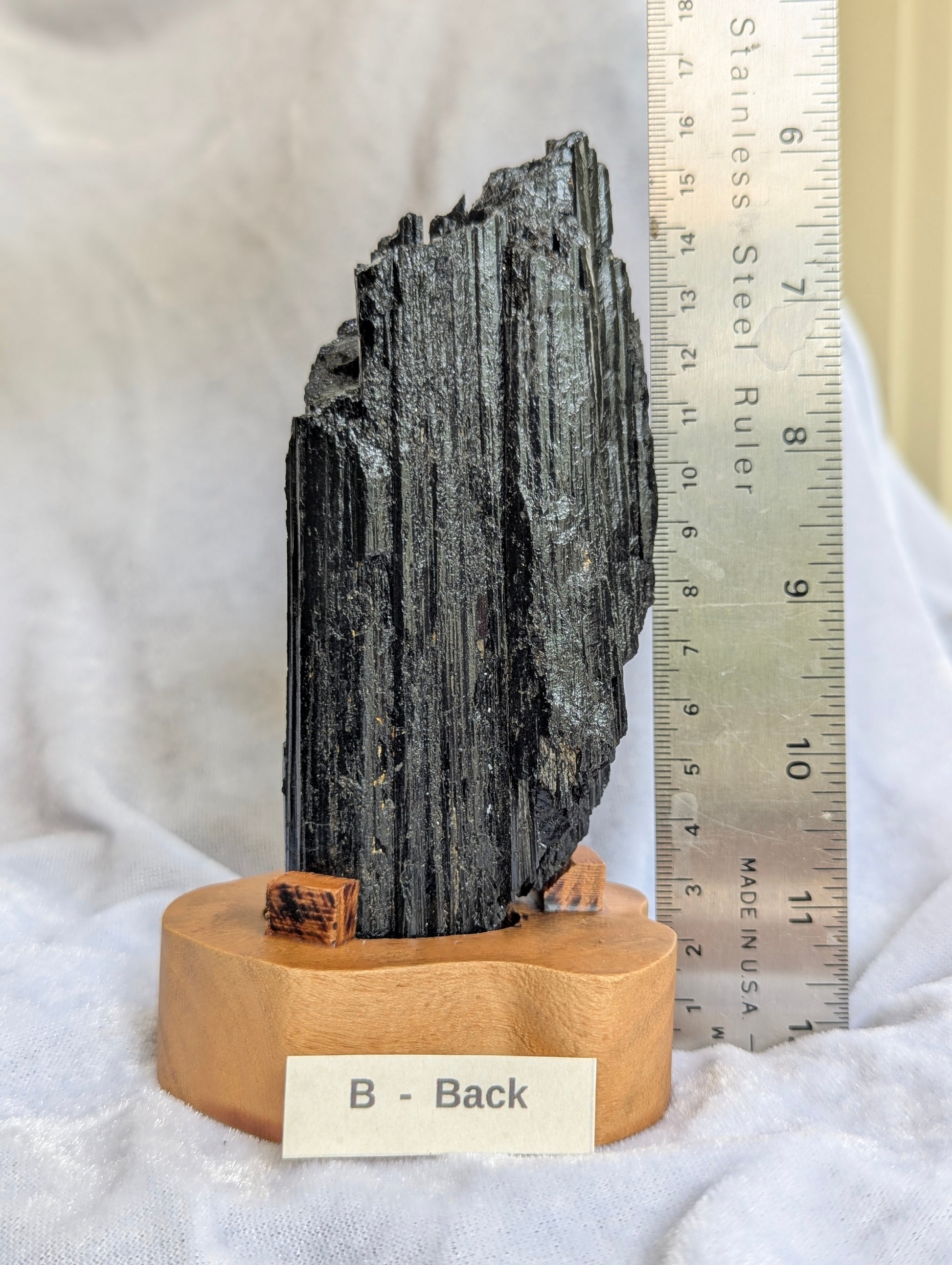 Back profile of 435g raw Black Tourmaline tower displaying natural crystal habit.