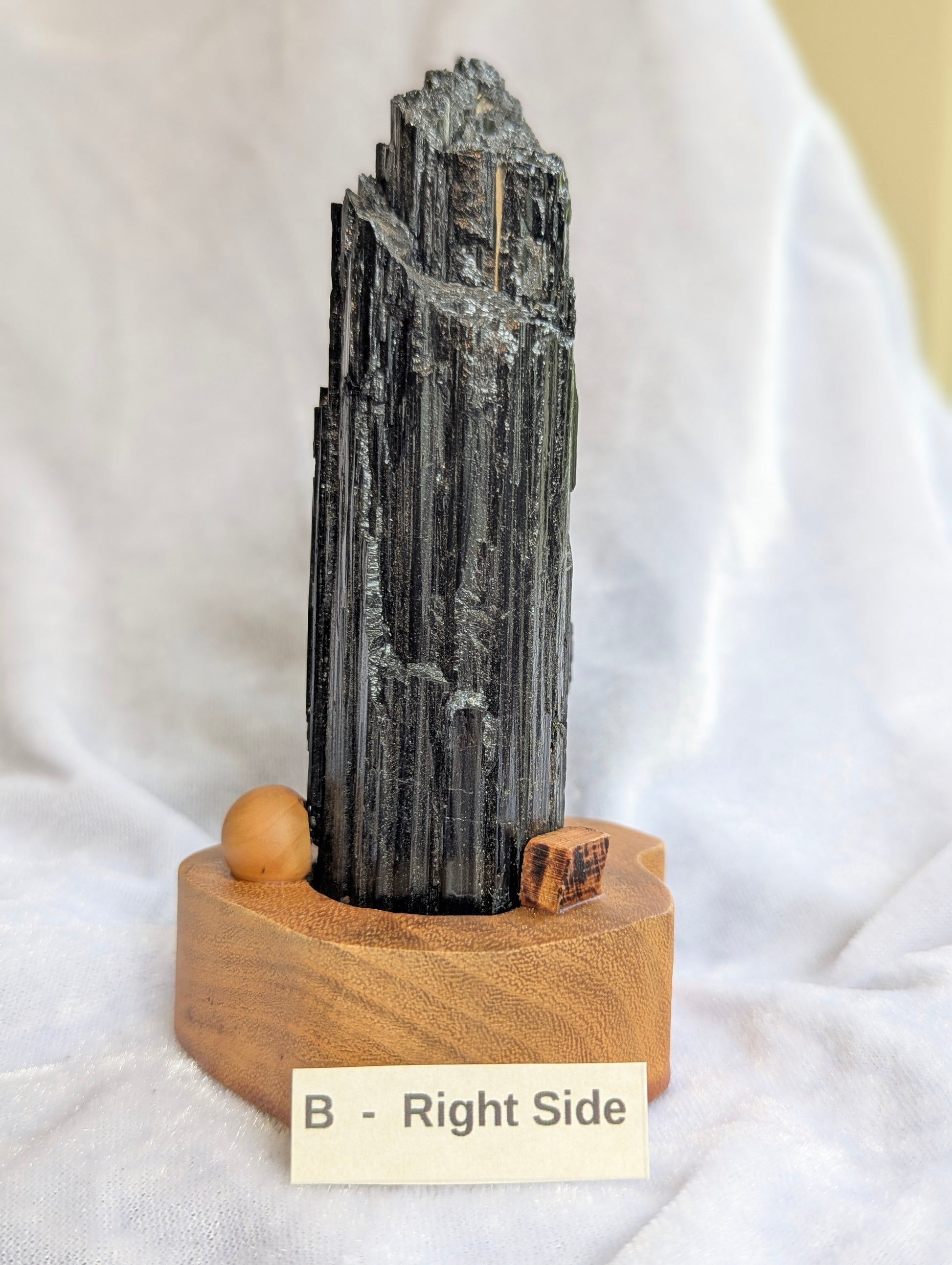 Right side profile of 435g raw Black Tourmaline tower displaying natural crystal habit.