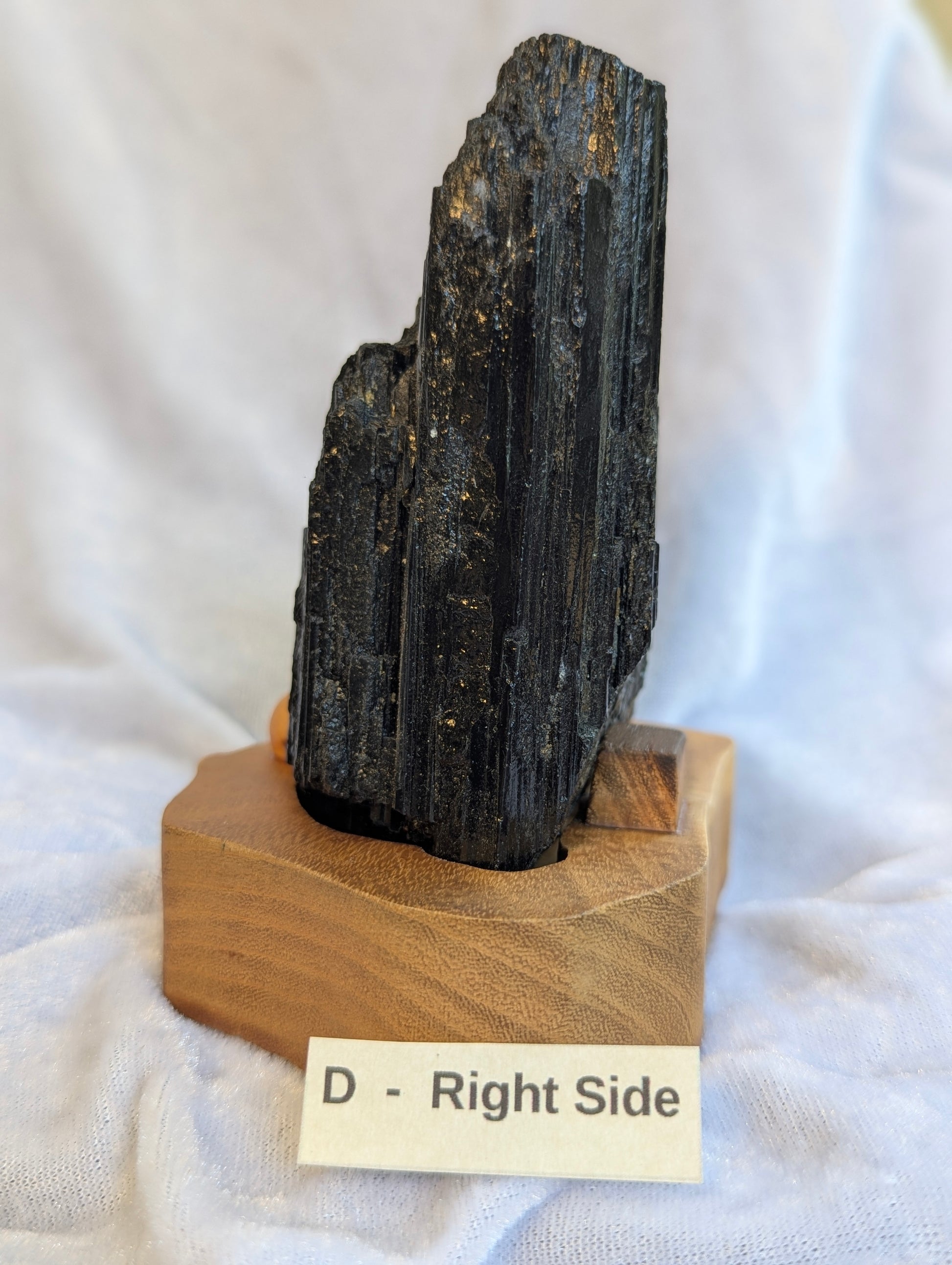 Right Side Profile view of 680g raw Black Tourmaline tower demonstrating structural height.