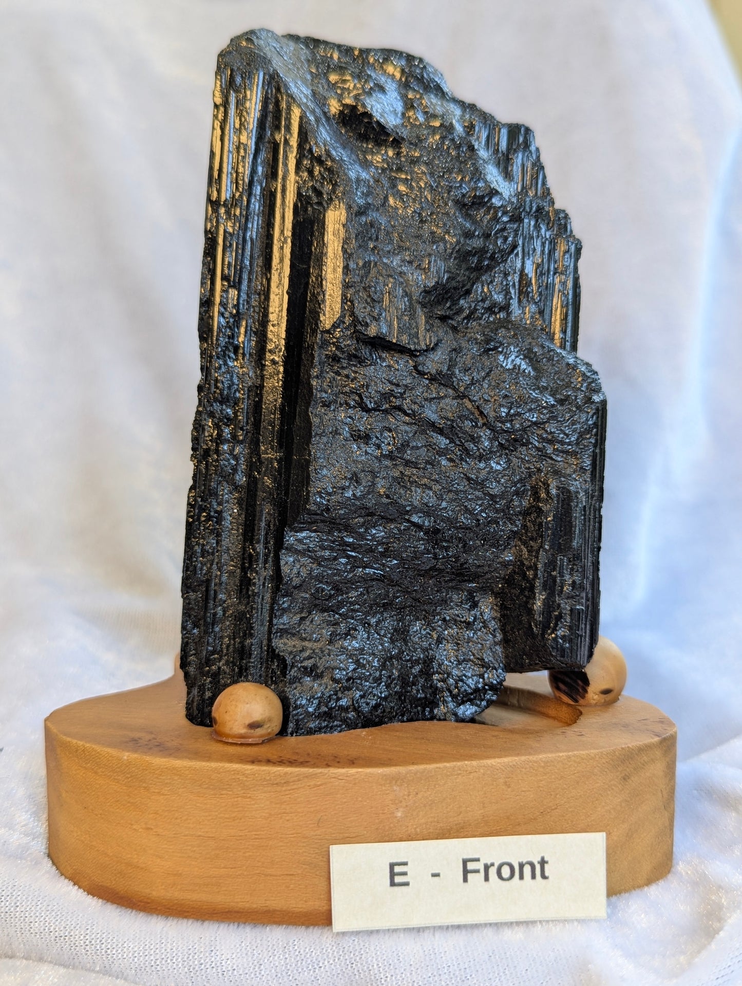 700g raw Black Tourmaline tower displaying exceptional structural density.