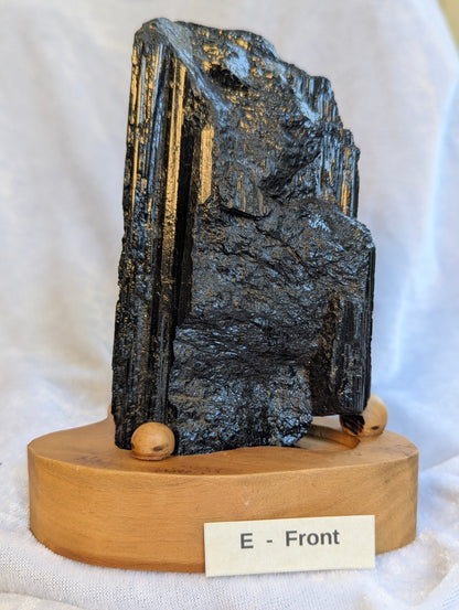 700g raw Black Tourmaline tower displaying exceptional structural density.