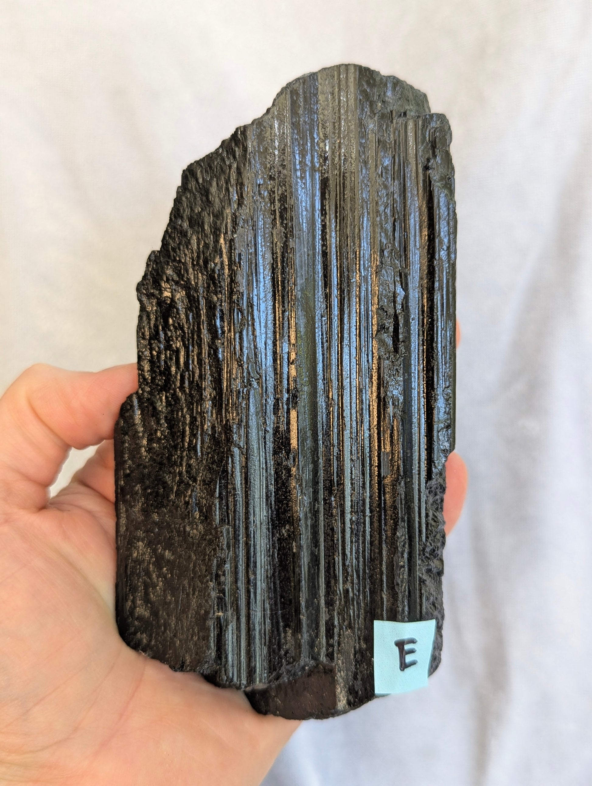 Close-up of natural mineral inclusions on 700g Black Tourmaline tower.