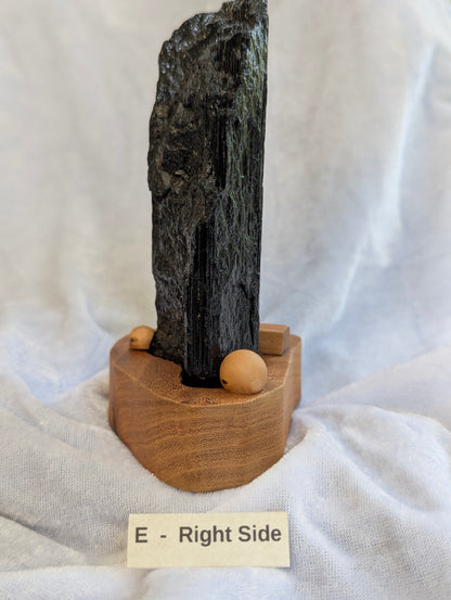 Side profile of 700g raw Black Tourmaline tower on stand.