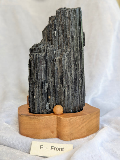 765g raw Black Tourmaline tower showing high vitreous luster.
