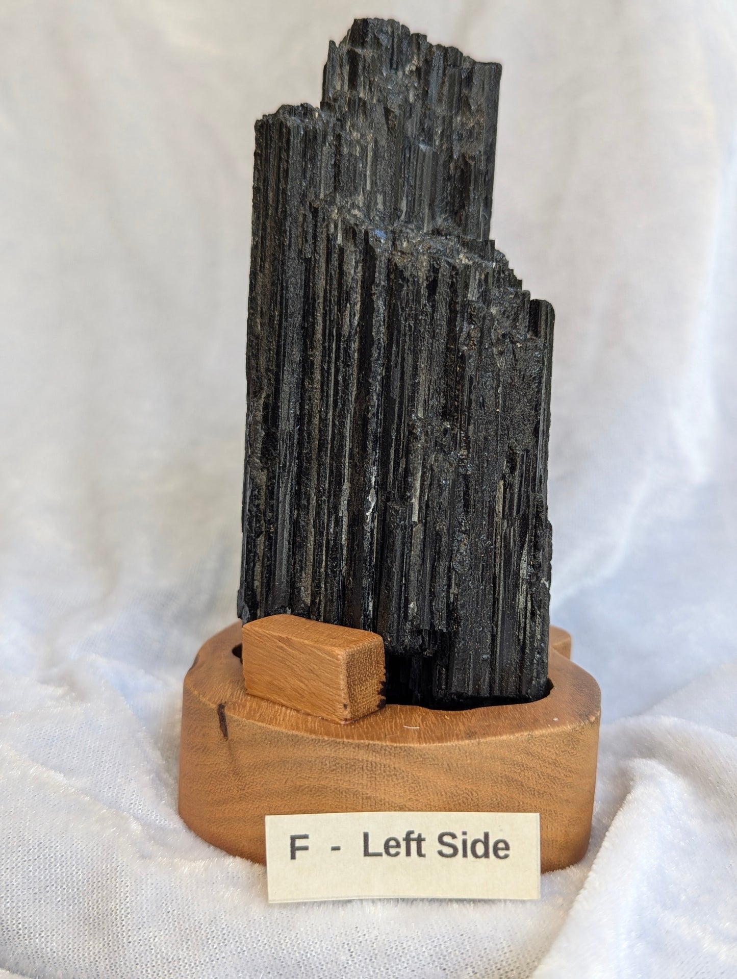 Left Side view of 765g raw Black Tourmaline tower on custom wooden base.