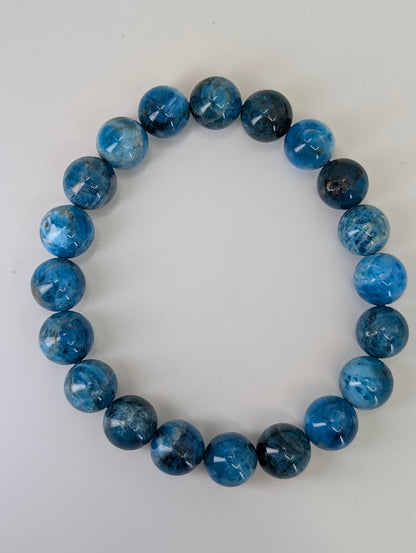 10 mm round Blue Apatite bracelet with vivid deep blue and natural matrix patterning