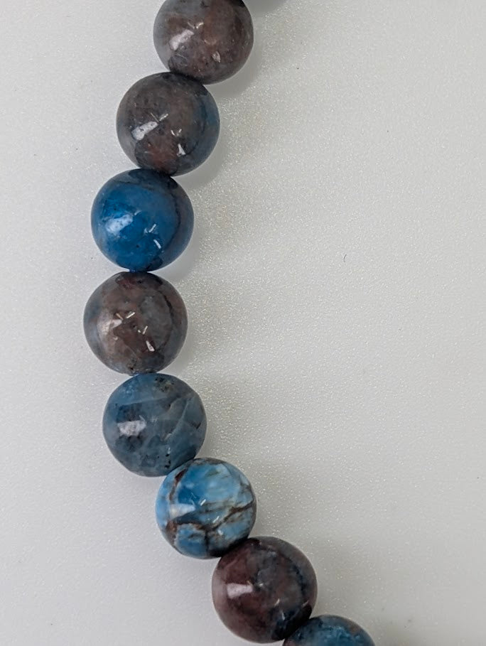 5 mm round Blue Apatite bracelet with vivid deep blue and natural matrix patterning