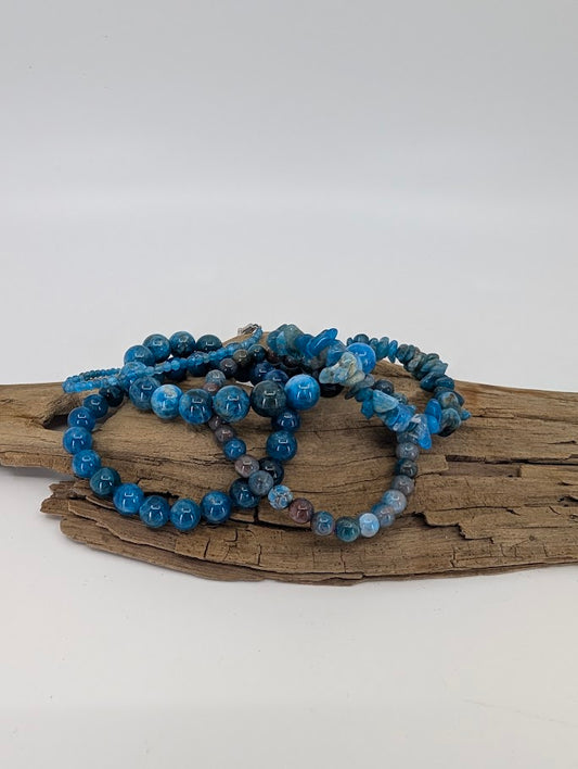 Overview of Blue Apatite bracelet collection including 3 mm, 5 mm, 8 mm, 10 mm, and chip styles from Madagascar