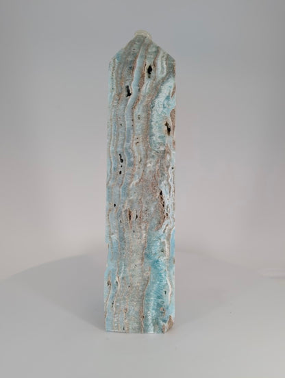 Blue Aragonite (Caribbean Calcite) Tower – side profile with layered banding and creamy calcite zones