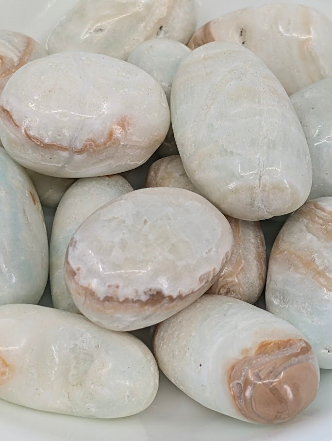 Close-up of blue and cream banding in Blue Aragonite