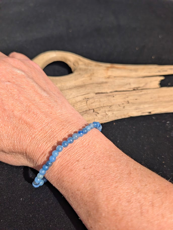 4mm Blue Aventurine beaded stretch bracelet worn on a wrist for delicate size scale.