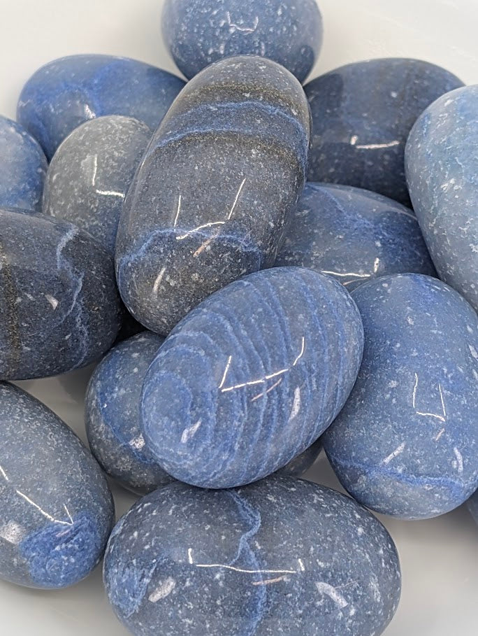 Close-up of Blue Aventurine tumbled stones showing natural banding and polish
