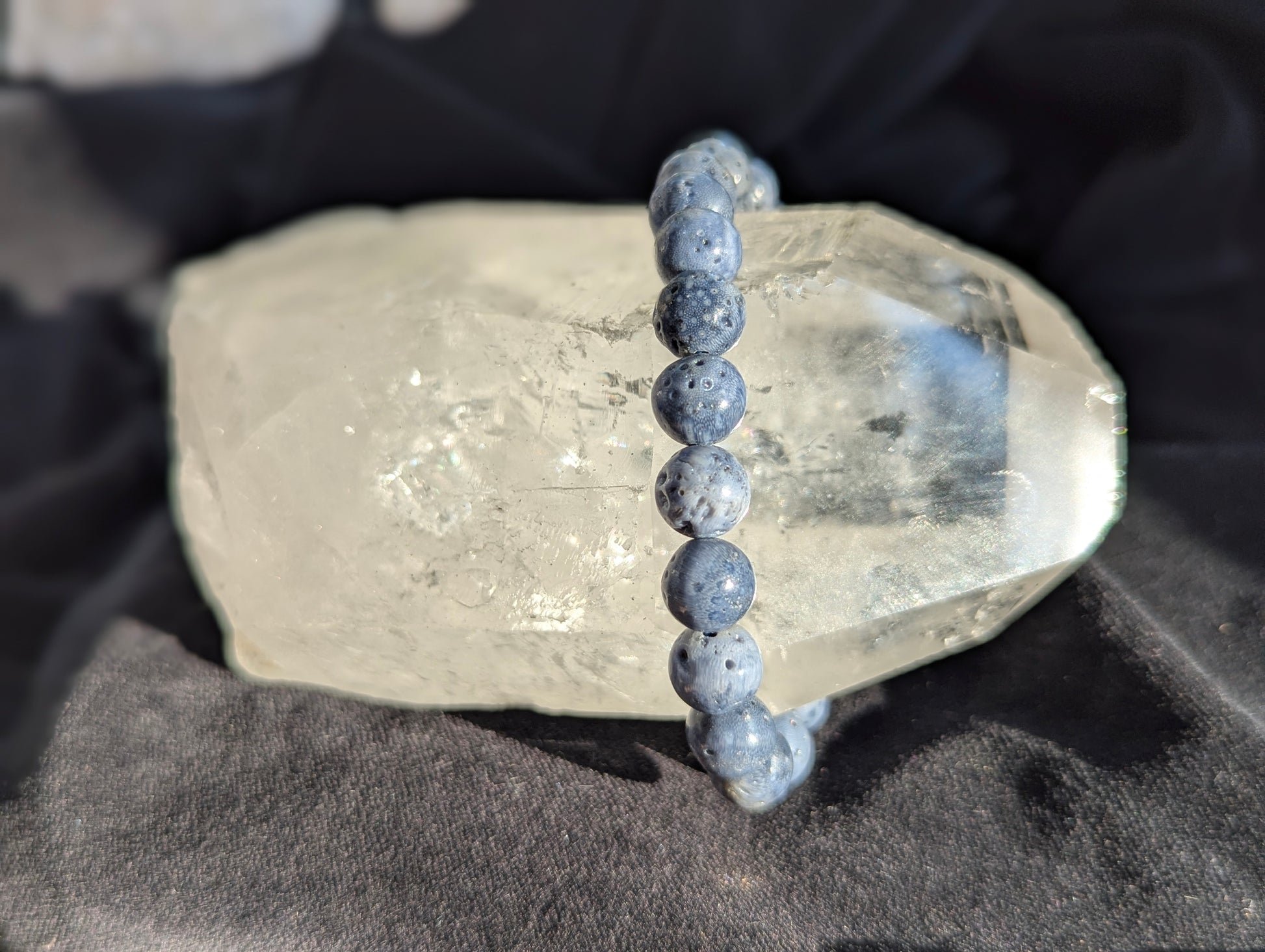 Premium 8mm Blue Sponge Coral beaded stretch bracelet displayed on a wrist to demonstrate its 17cm (6.69") circumference scale and continuous organic mineral profile under balanced lighting.