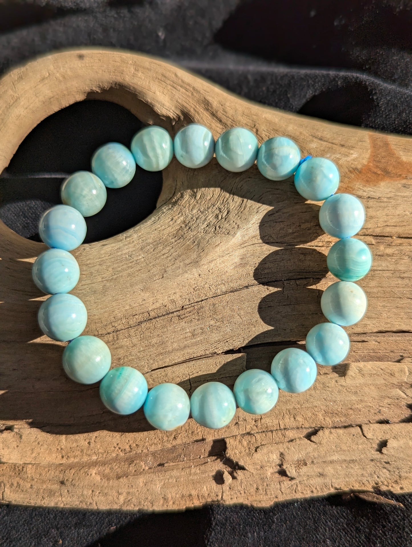A premium 9mm Blue Hemimorphite beaded stretch bracelet featuring 20 polished spheres with distinctive cloudy white and blue zoning.