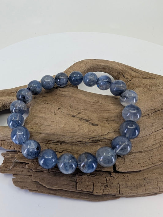 9mm Blue Kyanite bead bracelet from Brazil showing rich indigo and denim tones on natural wood.
