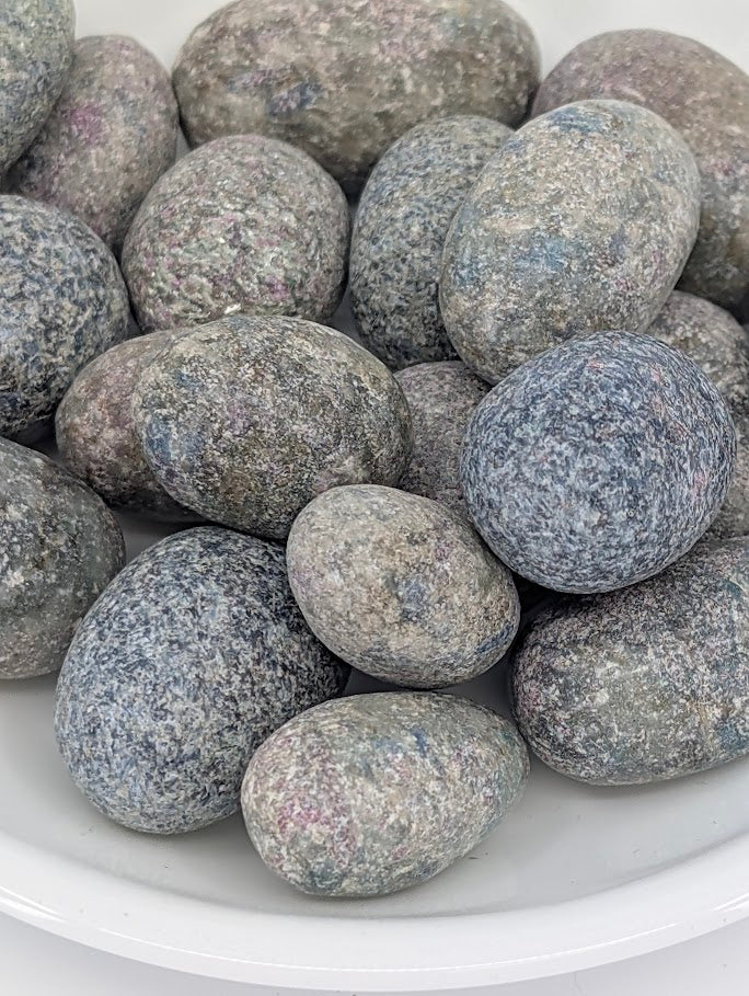 Close-up of Blue Kyanite tumbled stones showing fibrous texture