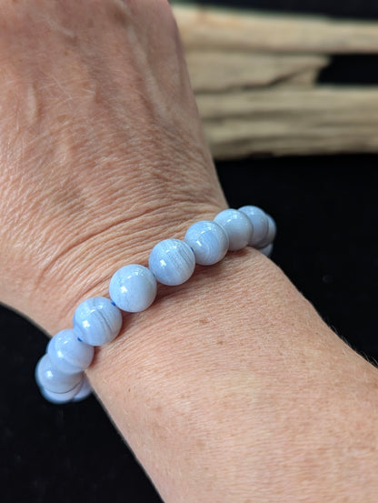 10mm premium Blue Lace Agate bracelet from Namibia being worn on a wrist.