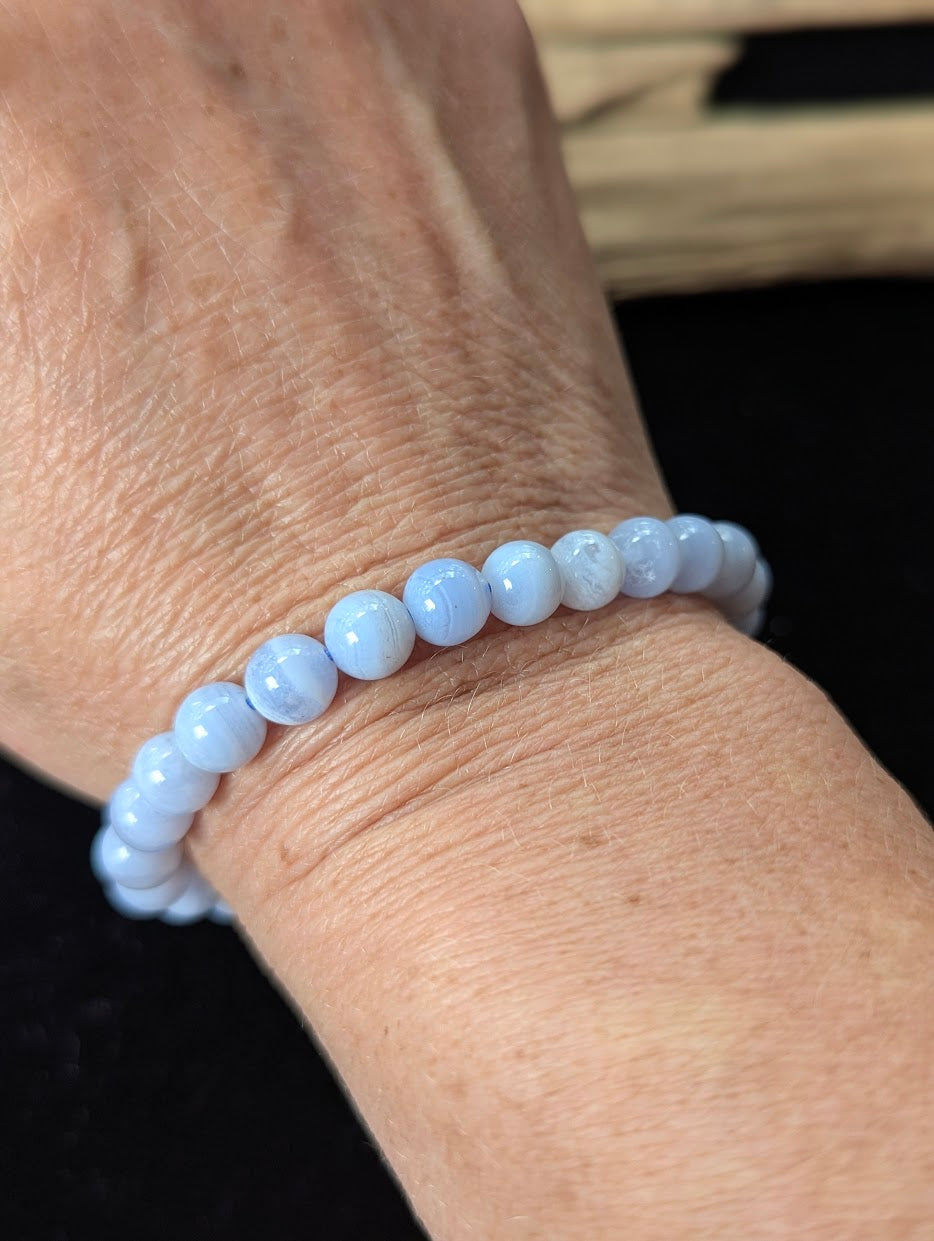 7mm premium Blue Lace Agate bracelet from Namibia being worn on a wrist.