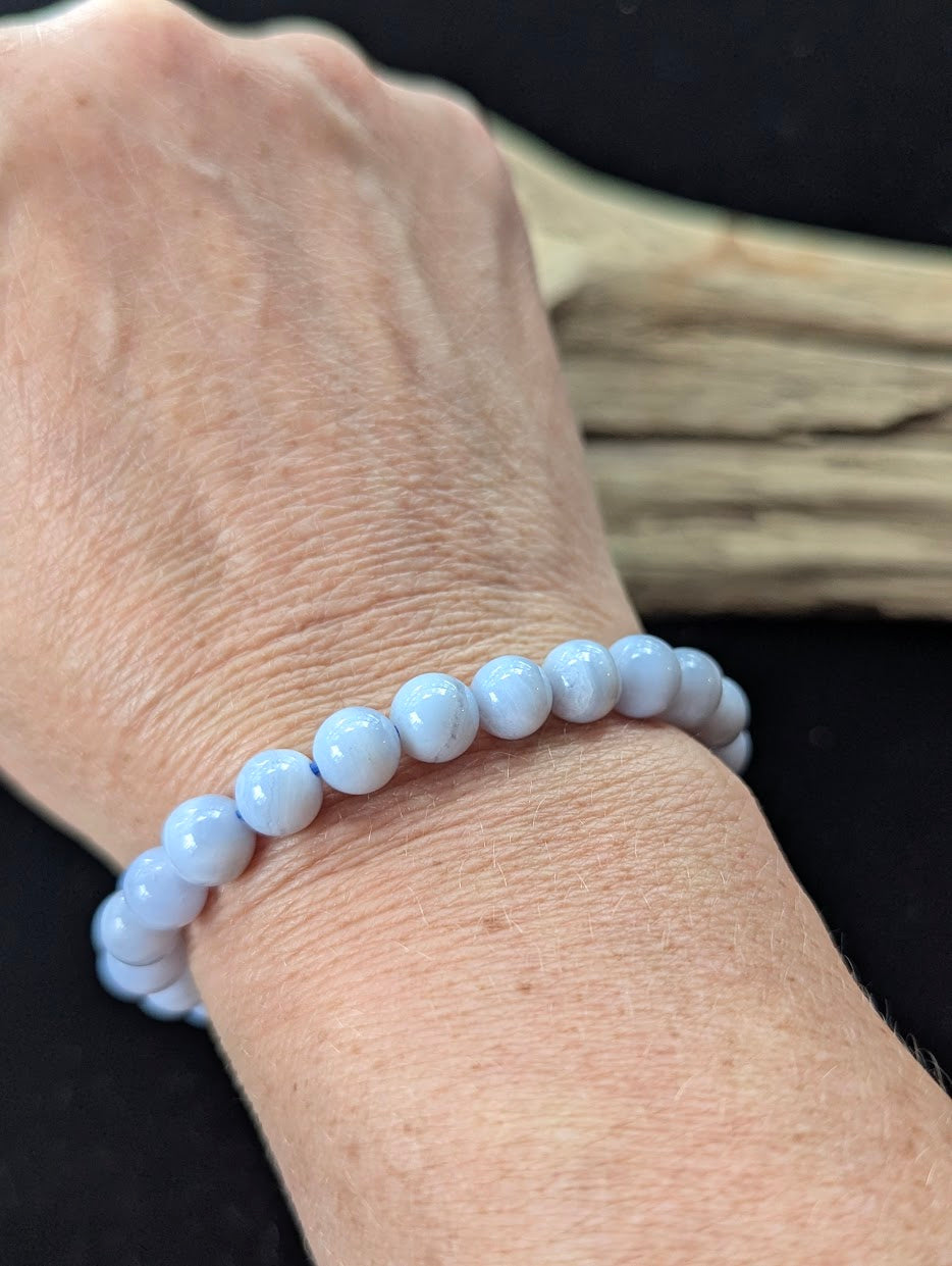 8mm premium Blue Lace Agate bracelet from Namibia being worn on a wrist.