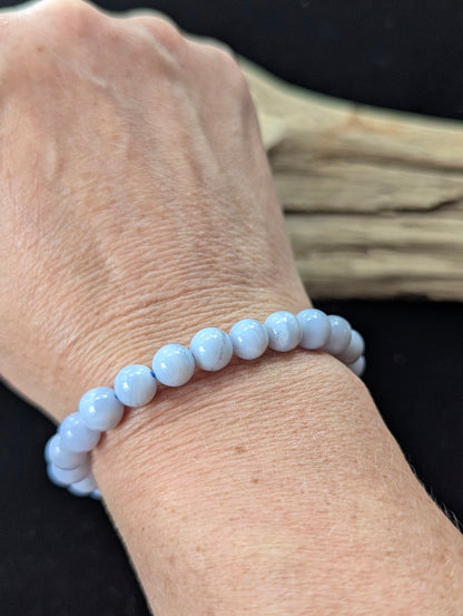 8mm premium Blue Lace Agate bracelet from Namibia being worn on a wrist.