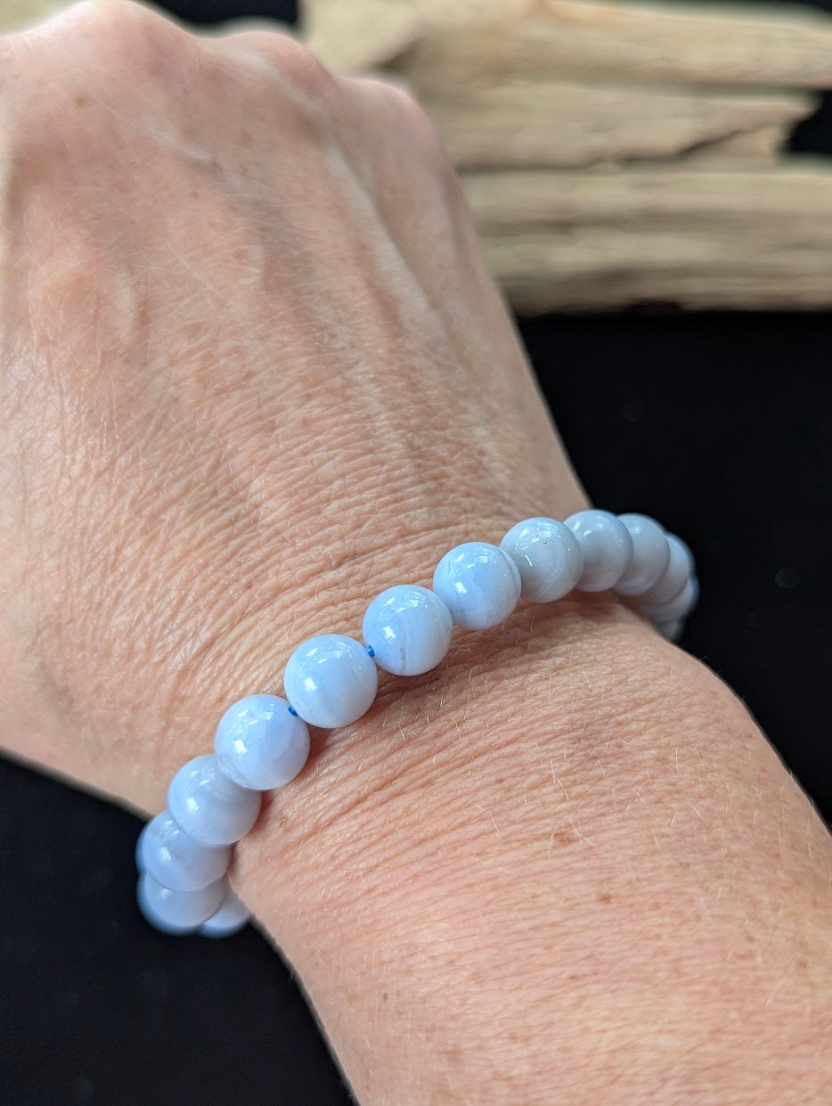 9mm premium Blue Lace Agate bracelet from Namibia being worn on a wrist.
