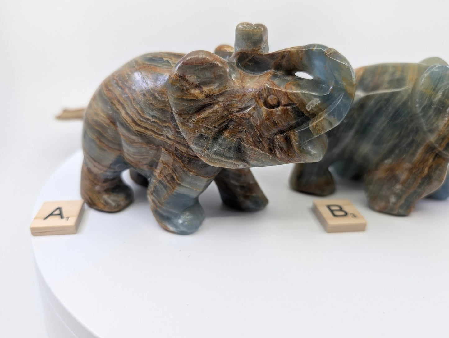 Hand-carved Blue Onyx (Banded Calcite) elephant specimen A1 from Argentina showing blue and honey-gold banding.