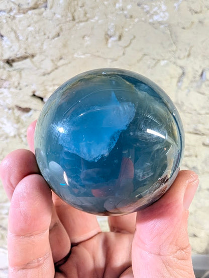 Translucent view of blue onyx sphere highlighting internal clarity