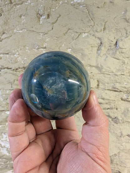 Base of sphere showing exposed natural calcite matrix