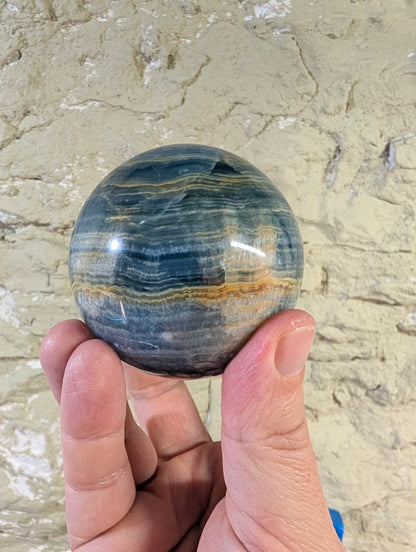 Top view of sphere with layered blue tones and smooth finish