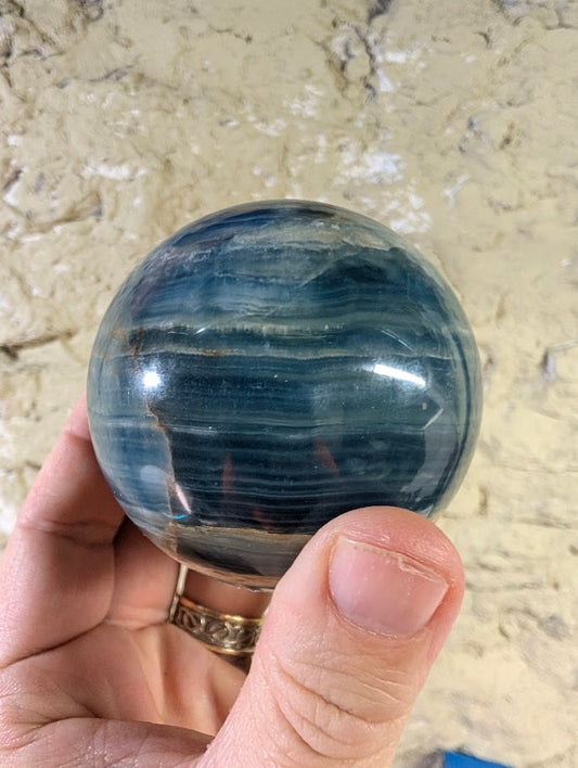 68mm sphere with sky-to-denim blue tones and polished surface