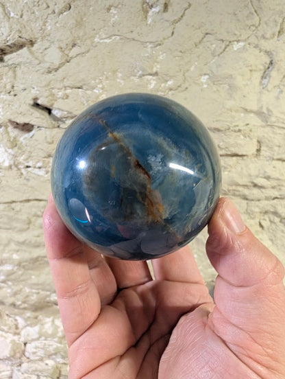 Back view with visible rust-colored seam and rich blue zoning