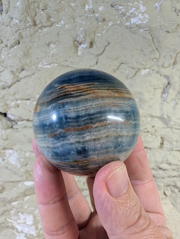 60mm Blue Onyx Sphere showing layered blue and brown banding