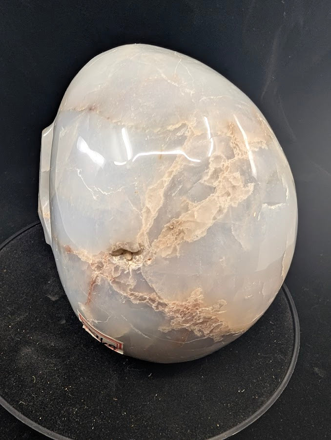 Back of skull with flowing cloud-like textures in translucent quartz